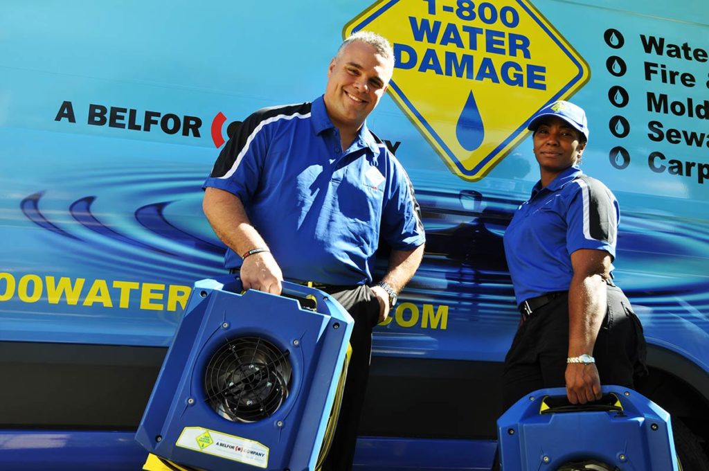 1-800 Water Damage techs with gear damage restoration franchise