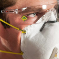 1-800 Water Damage tech with protective glassesDamage tech with protective glasses and mask